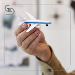 hand holding airplane toy